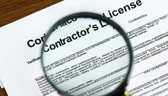 A magnifying glass focusing on a contractors lice